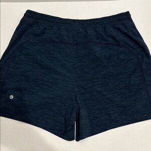 LULULEMON Pace Breaker Short 5”. Size L
Heather Allover Iron Blue True Navy